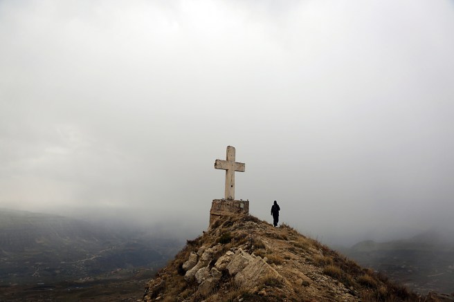 TOPSHOT - A Lebanese trecker takes a pic